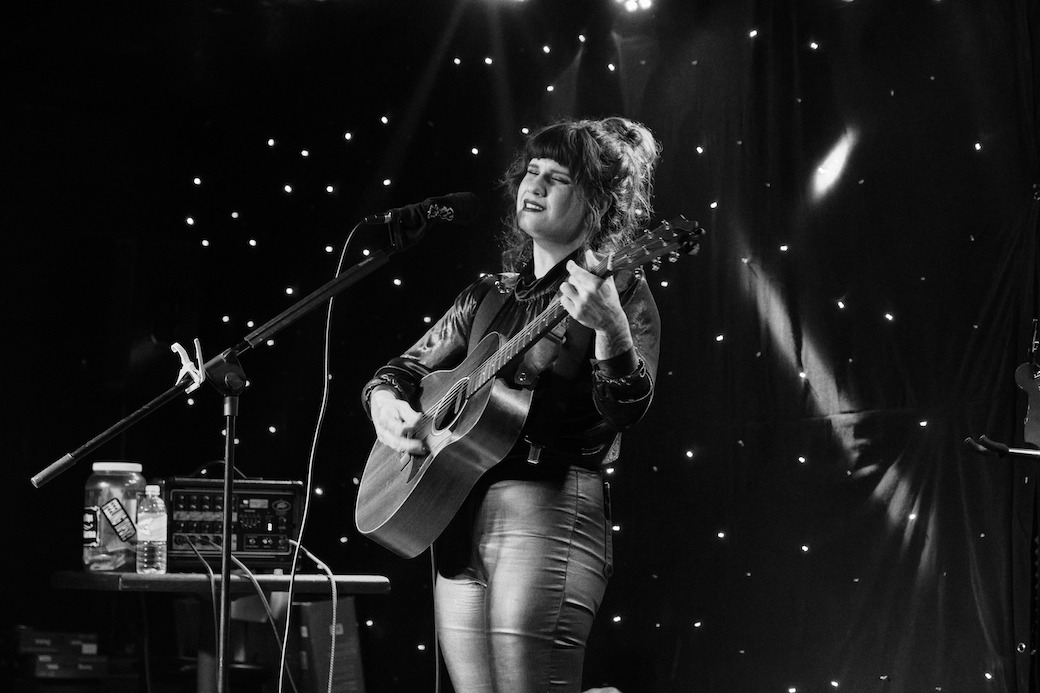 Black and white photo of Samantha Hunt performing in Bentoville Arkansas