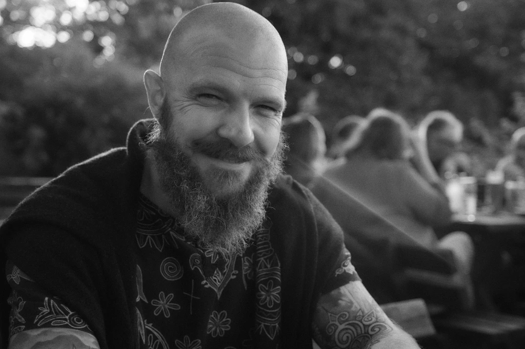 Black and white photo of smiling friend in Prague