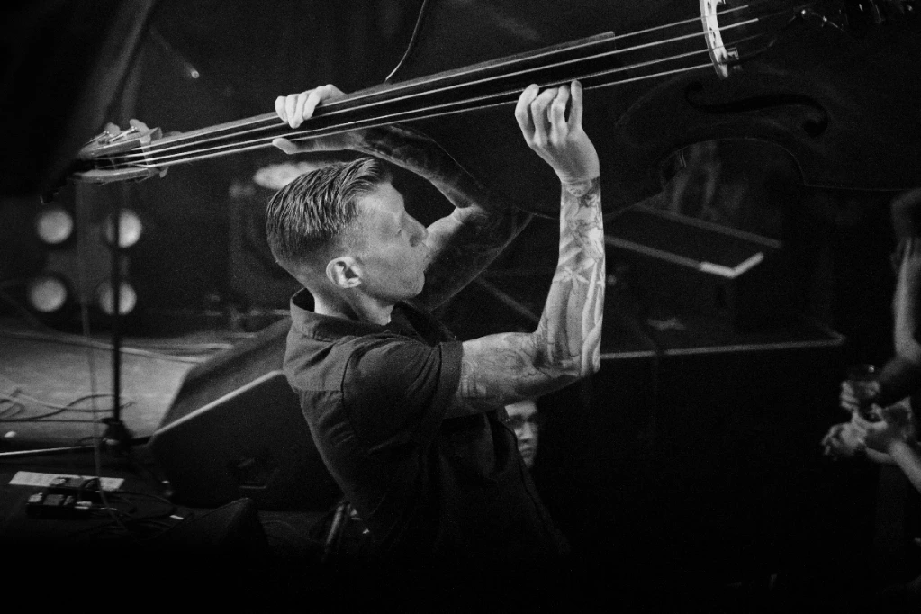 Black and white photo of Asian dub Foundation performing at Rock for Churchill