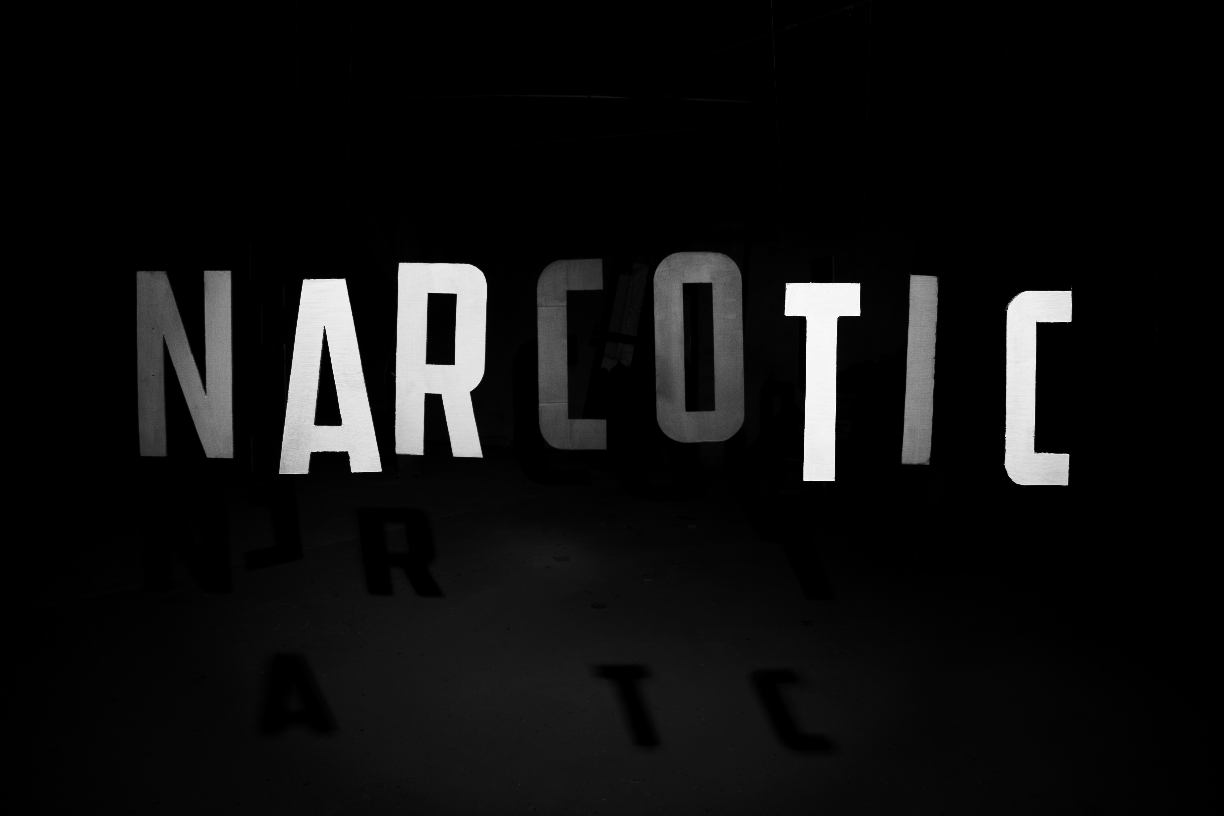 Black and white photo of Narcotic Fields logo